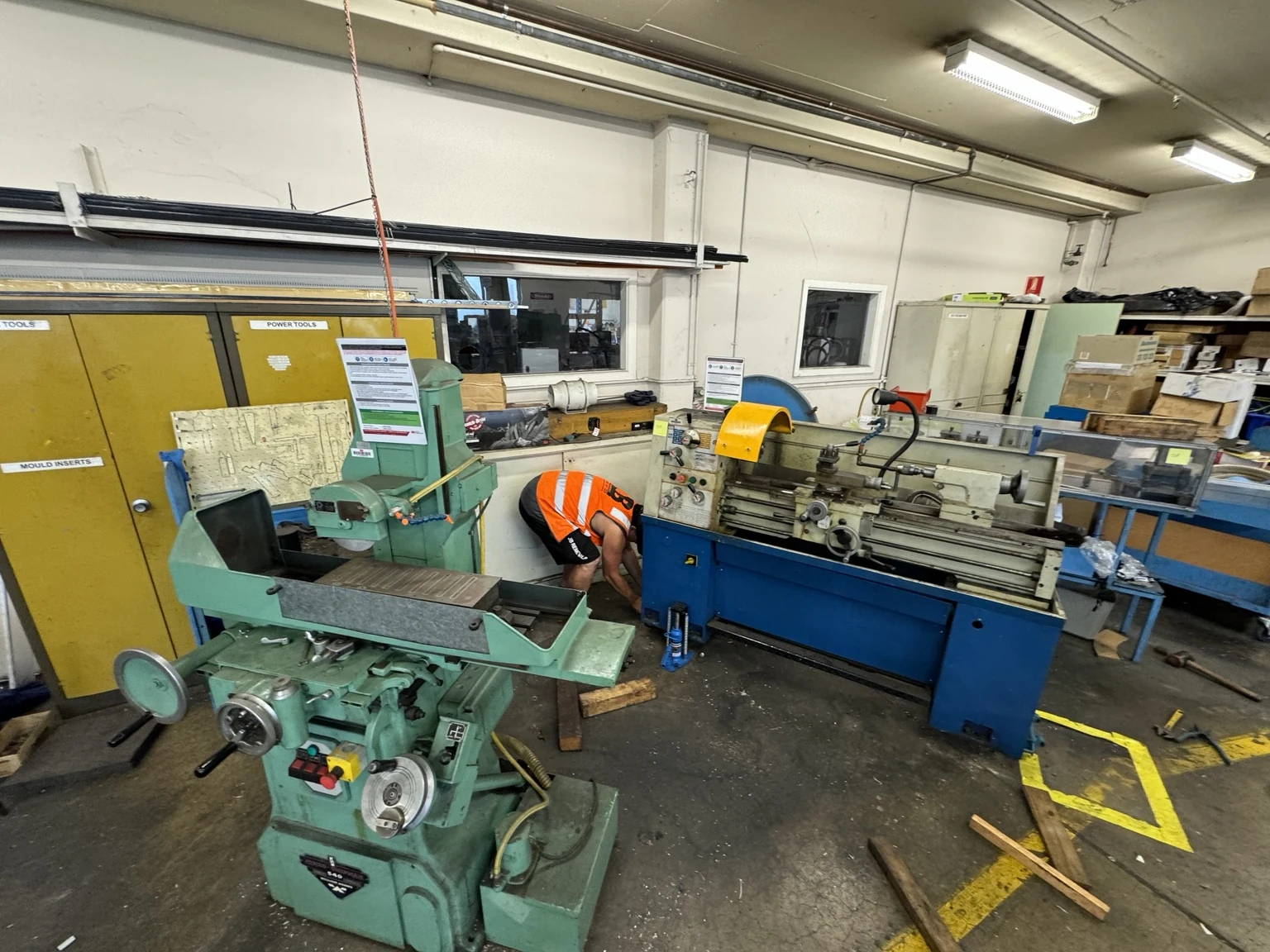 Workshop machinery and crew preparing for the Brisbane factory relocation.